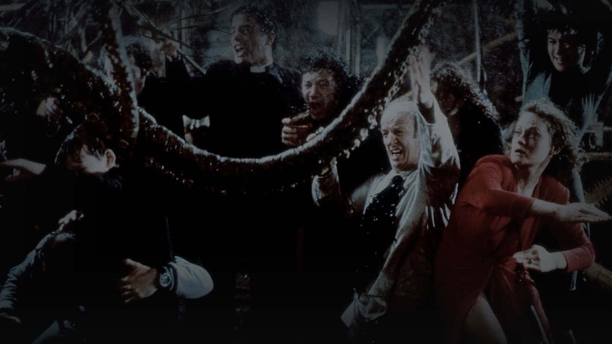 Still from High Spirits (1988) — letterboxd still; genuine film still from the climactic supernatural chaos. baked through scripts/bake_dark_photo.py at factor 0.45, 1200x675